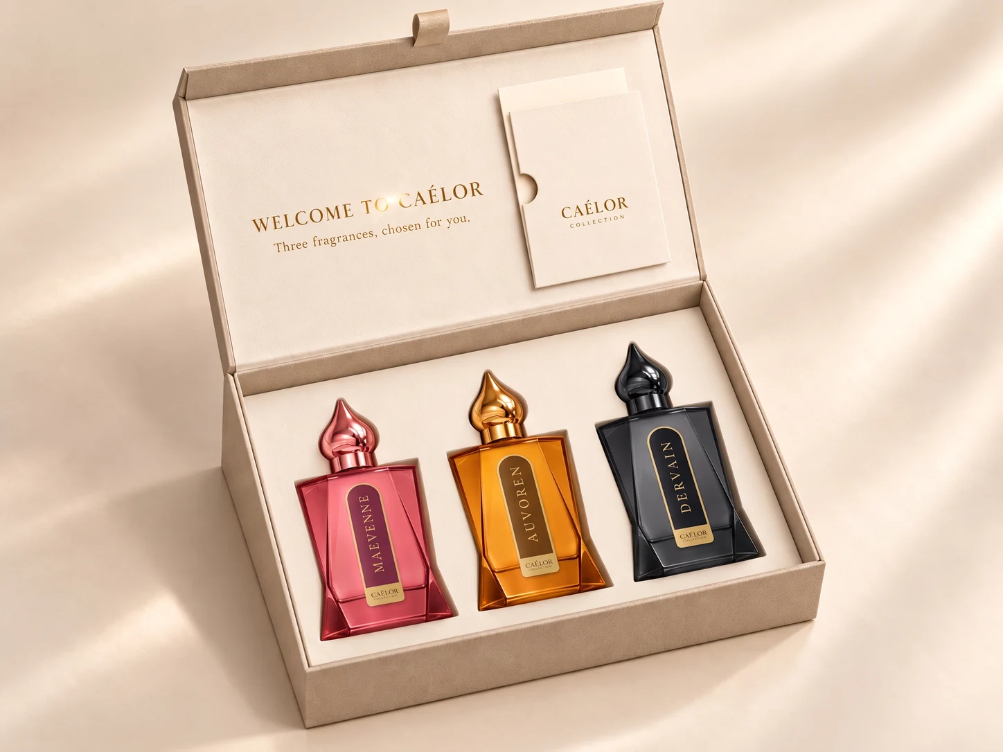 Open beige CAÉLOR gift box with three perfume bottles and a presentation card